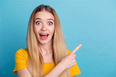 Photo Of Excited Sweet Young Woman Dressed Shirt Smiling Pointing Finger Empty Space Isolated