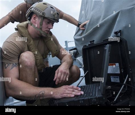 A Sailor Assigned To Explosive Ordnance Disposal Mobile Unit EODMU 5