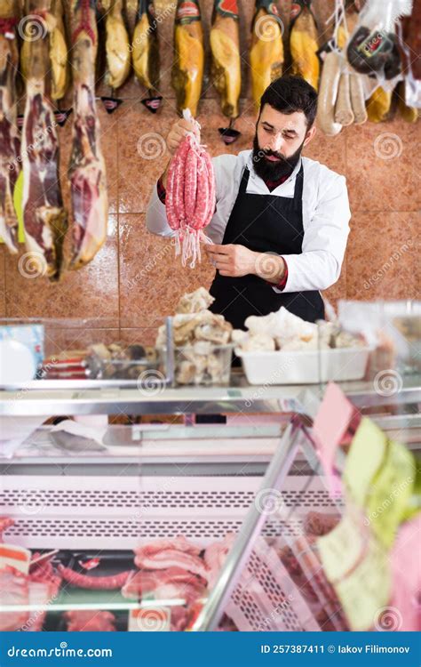 Shop Seller Showing Sausages In Butcher Shop Stock Image Image Of