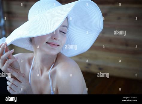 A Lady In Bikini Wearing Beach Hat Stock Photo Alamy