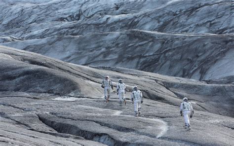 Four Men Climbing Grey Rock Formation During Daytime HD Wallpaper