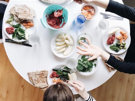 Premium Photo Two People Eating Lunch