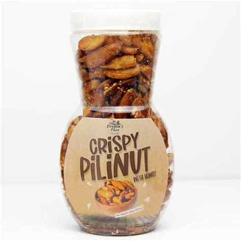 A Jar Filled With Nuts Sitting On Top Of A Table