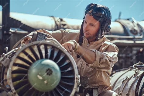 Free Photo | Portrait of a pilot-mechanic in uniform and flying helmet ...