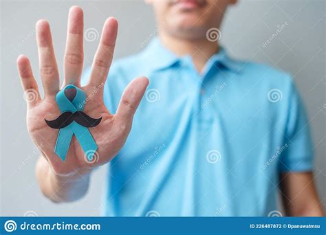 November Prostate Cancer Awareness Month Man Holding Blue Ribbon With