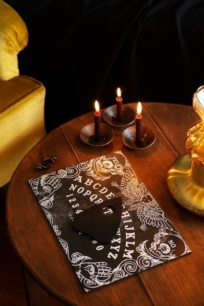 Premium Photo Ouija Board And Lit Candles Arrangement