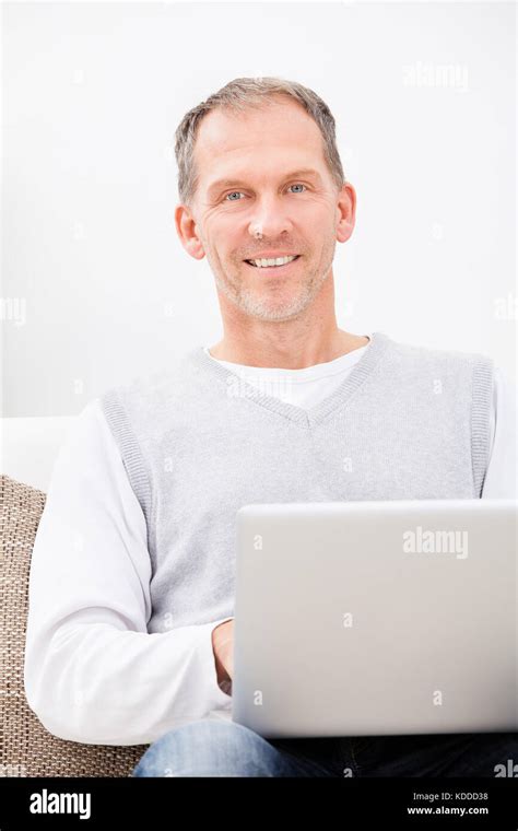 Mature Man Sitting On Couch Hi Res Stock Photography And Images Alamy