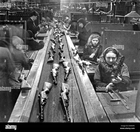 SOVIET ARMAMENTS Women workers fitting out PPSH-41 submachine guns on a ...