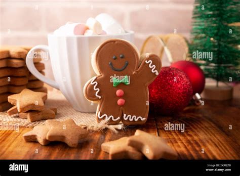 Christmas Homemade Gingerbread Man Cookie And White Cup With Hot Chocolate With Marshmallows