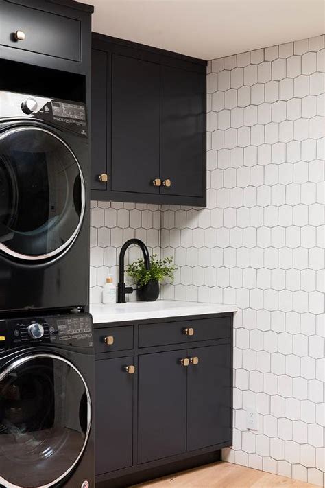 Double Stacked Black Front Load Washers And Dryers Modern Laundry Room