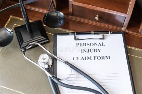 Legal Personal Injury Claim Form With Scales Of Justice Stock Image