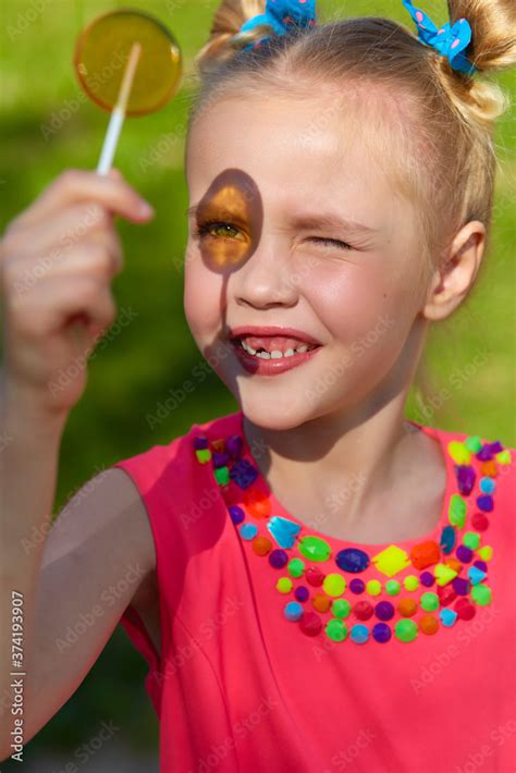 Vertical Photo Close Up Portrait Of A Cheerful Girl In The Park A Six