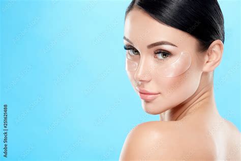 Beautiful Girl With Nude Make Up And Naked Shoulders At Studio Background Invisible Eye Patches