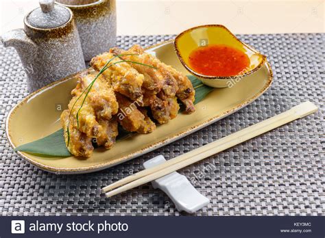 Fried chicken wings with sauce Stock Photo - Alamy