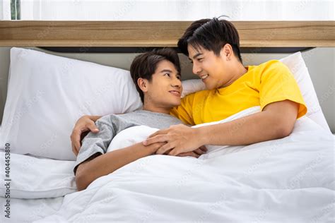 Happy Asian Homosexual Gay Men Male Couple Lying And Embracing On Bed LGBT And Sexual Diversity