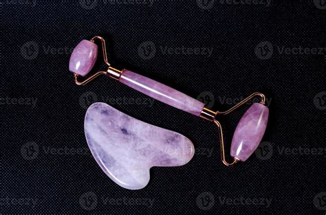 Rose Quartz Facial Roller And Massage Stone Gua Sha Isolated On White