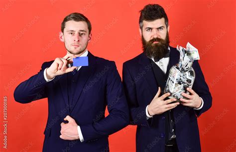 Men In Suit Businessmen With Jar Full Of Cash And Credit Card Red Background Mature Man And