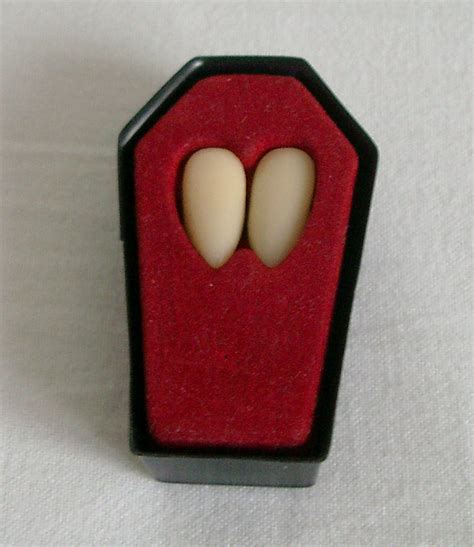 Vampire Teeth in Coffin by empty-paper-stock on DeviantArt