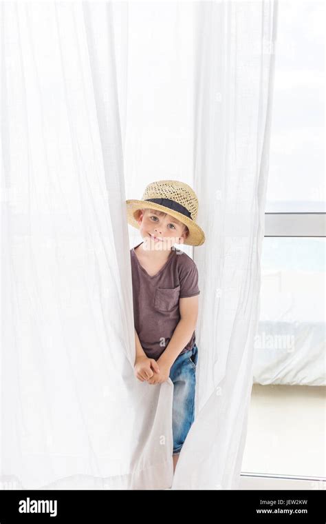 Portrait of boy wearing straw hat Stock Photo - Alamy