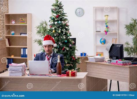 Young Male Employee Celebrating New Year In The Office Stock Image