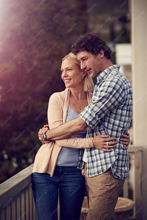 Premium Photo Enjoying The View From Their Balcony Shot Of A Mature