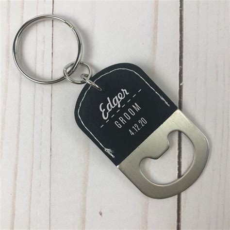 A Bottle Opener Keychain With The Name Eden Groom On Its Back