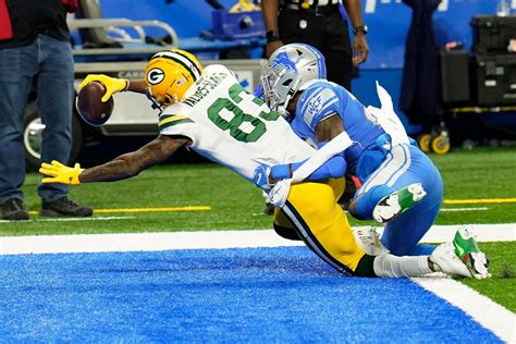 Rodgers Led Packers Beat Lions 31 24 Clinch Nfc North Title