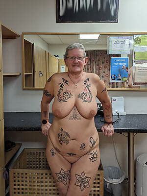 Big Busted Superannuated Women With Tattoos Displaying Her Pussy