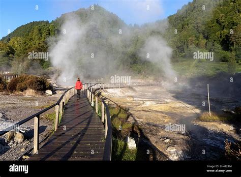 Lagoa Das Furnas E Fumarolas Woman Walking On A Site Of Bubbling Hot