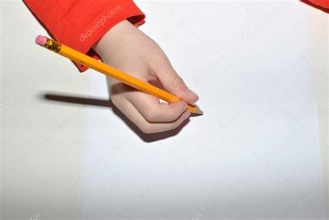 Child writing with pencil Stock Photo by ©lulu2626 68779095