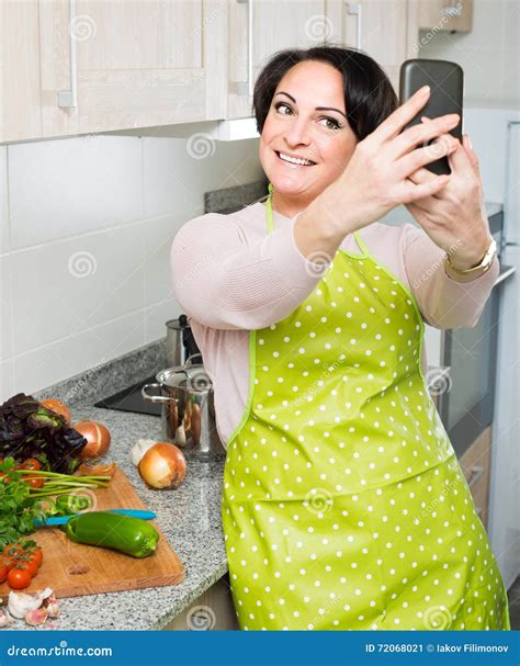 Portrait Of Housewife In Apron Making Selfie In Domestic Kitchen Stock Image Image Of Casual