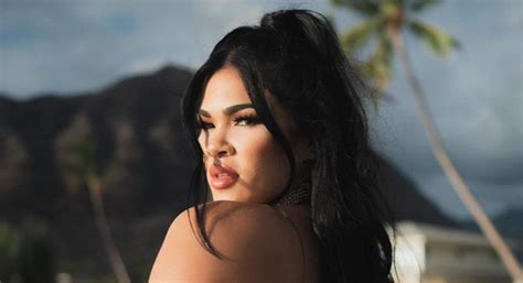 UFC S Rachael Ostovich Sizzles In A Black Bikini To Show Off Cleavage Massive Butt VIDEO PIC