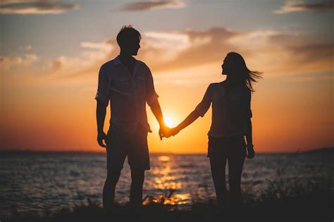 Two People Silhouette Holding Hands