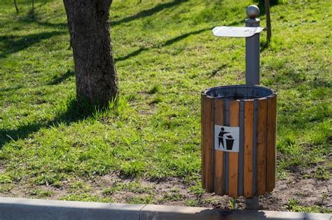 Premium Photo Garbage Bin By The Path In The Park