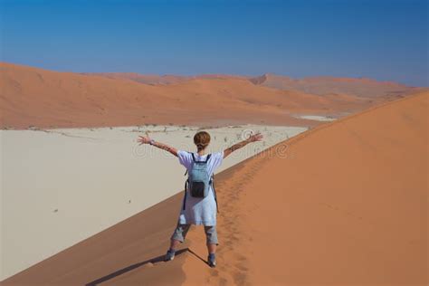 Tourist Walking On The Scenic Dunes Of Sossusvlei Namib Desert Namib Naukluft National Park