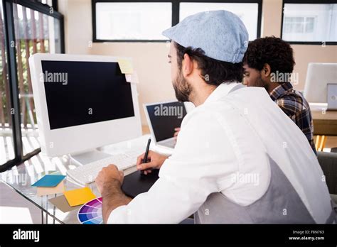Gay Couple Working In Office Stock Photo Alamy