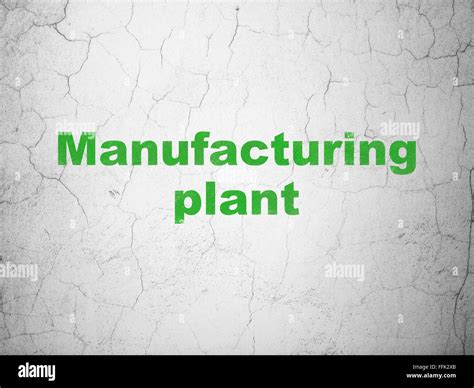 Manufacuring concept: Manufacturing Plant on wall background Stock Photo - Alamy