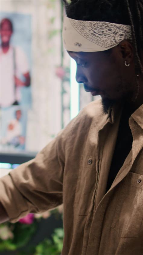 Vertical video Tracking shot of customer in clothing store during