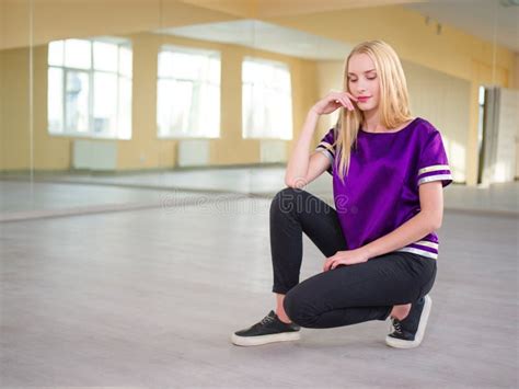 Cute Girl Blonde Sitting Posing In A Light Dance Studio Stock Image Image Of Active