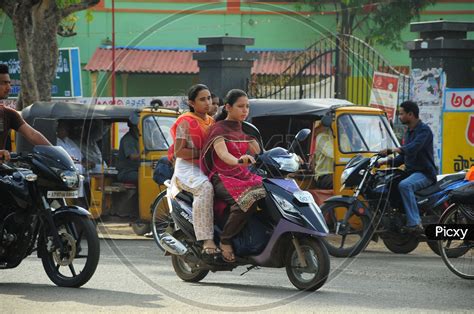 Image Of Indian College Girls Riding Scooty Jm Picxy