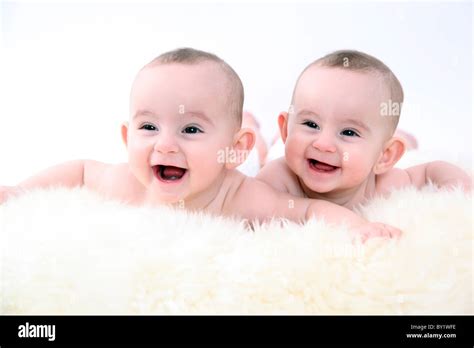 twin baby girls smiling Stock Photo - Alamy