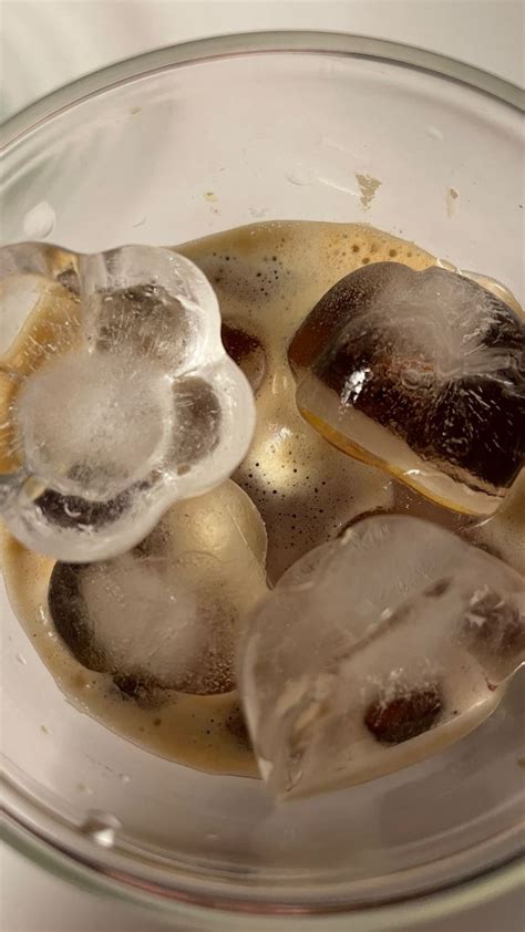 Ice Cubes In A Glass Bowl Filled With Liquid