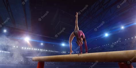 Premium Photo Female Gymnast Doing A Complicated Trick On Gymnastics