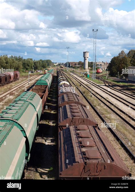 Freight train wagons on the station rails Stock Photo - Alamy