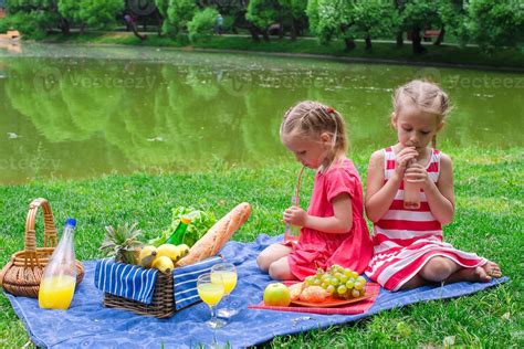 Two little kids on picnic in the park 17705761 Stock Photo at Vecteezy