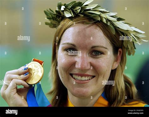 Australias Anna Meares Shows Her Gold Medal After Breaking The Olympic