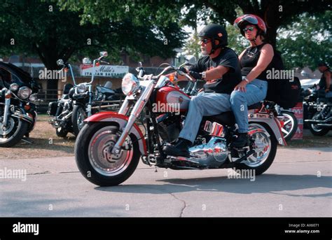 Biker with girl on Harley Davidson at 100th anniversary, Milwaukee ...