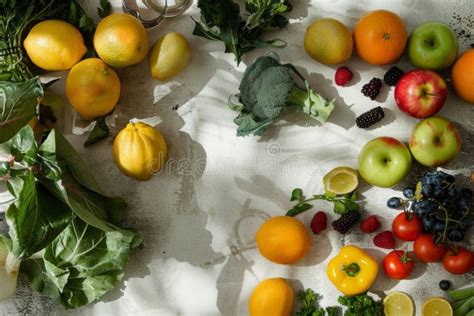An Array of Colorful Fruits and Vegetables is Spread Across the Table ...