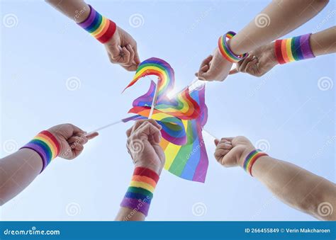 Diversity Of Gays Hands Wear Rainbow Wristbands Holding Lgbt Flags Up