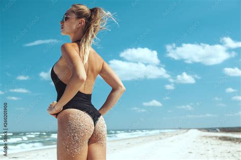 Beautiful Model In Bikini Posing At The Beach Stock Photo Adobe Stock